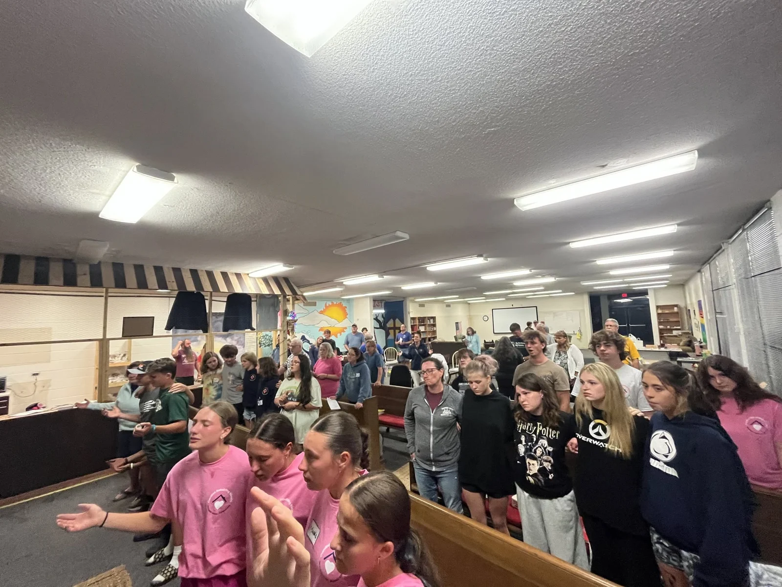 Volunteers gathered together indoors at CRM